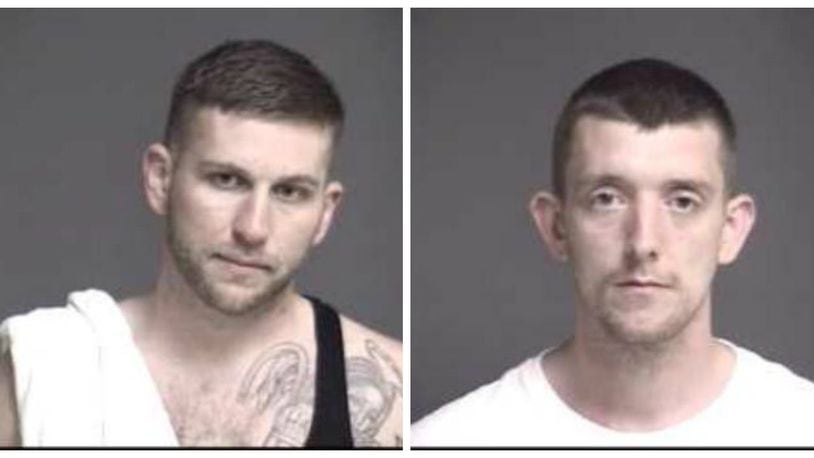 Daniel Hatfield Jr. and Jeremy Mink remained in the Warren County Jail today awaiting arraignment on charges of escape from a state community corrections center on Ohio 63, across from two state prisons.