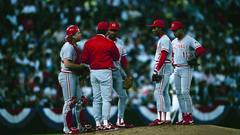 OAKLAND, CA - OCTOBER 20: (L-R) Catcher Joe Oliver #9, Manager Lou Piniella, pitcher Jose Rijo #27, Mariano Duncan #7 and Barry Larkin #11 of the Cincinnati Reds confer on the mound during Game Four of the 1990 World Series against the Oakland Athletics on October 20, 1990 at Oakland Alameda Coliseum in Oakland, California. The Reds defeated the Athletics 7-2 to win the World Series 4-0. (Photo by Otto Greule Jr./Getty Images)