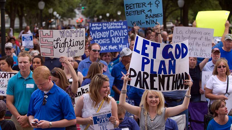 Abortion opponents gathered outside the Capitol on July 8, 2013 to hear speeches and rally in favor of legislation to regulate abortion clinics in Texas. ALBERTO MART펅Z / AMERICAN-STATESMAN