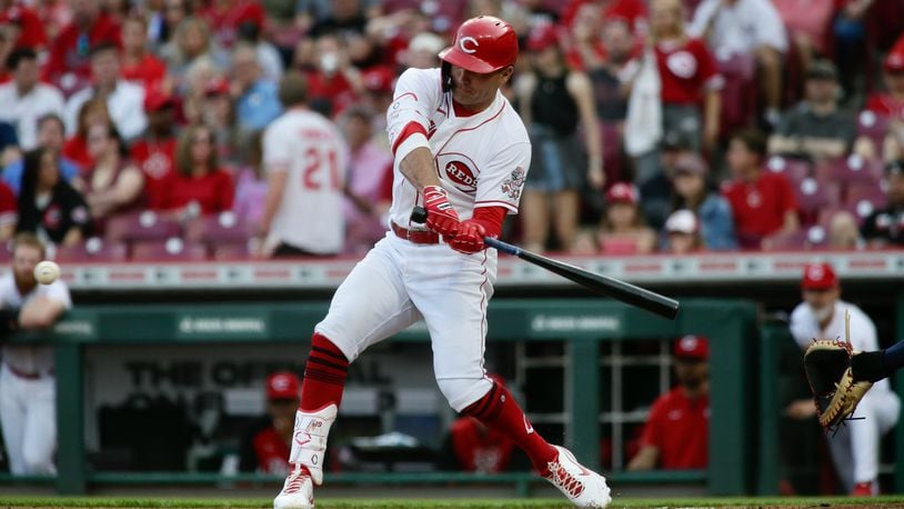 Joey Votto, of the Reds, singles in the first inning against the Cardinals on Friday, April 22, 2022, at Great American Ball Park in Cincinnati. David Jablonski/Staff