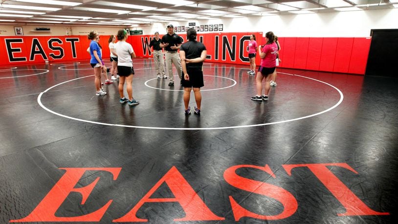 West Chester Police Officers Phil Chaney and Michelle Berling lead a self-defense class Monday, May 12, 2014, at Lakota East High School. NICK DAGGY / STAFF