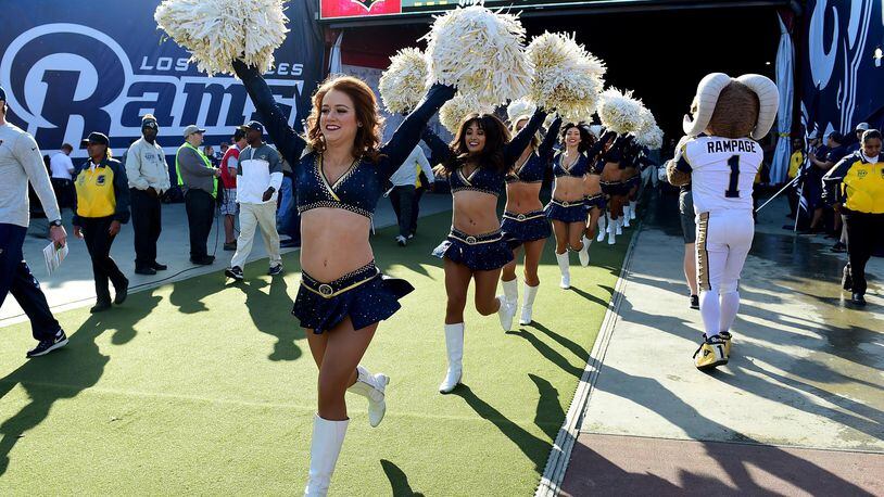 FILE PHOTO: Los Angeles Rams cheerleaders take to the field before the game against the Arizona Cardinals at Los Angeles Memorial Coliseum on January 1, 2017 in Los Angeles, California.  (Photo by Harry How/Getty Images)