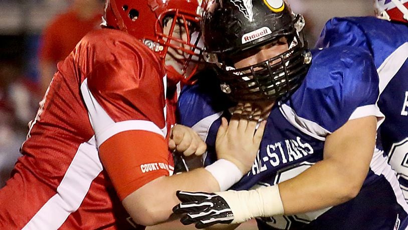 West offensive lineman Logan O’Neil of Fairfield (left) squares off with East defensive lineman Hunter Burdno of Lakota East on Thursday during the Ron Woyan East-West All-Star Game at Kings. CONTRIBUTED PHOTO BY E.L. HUBBARD