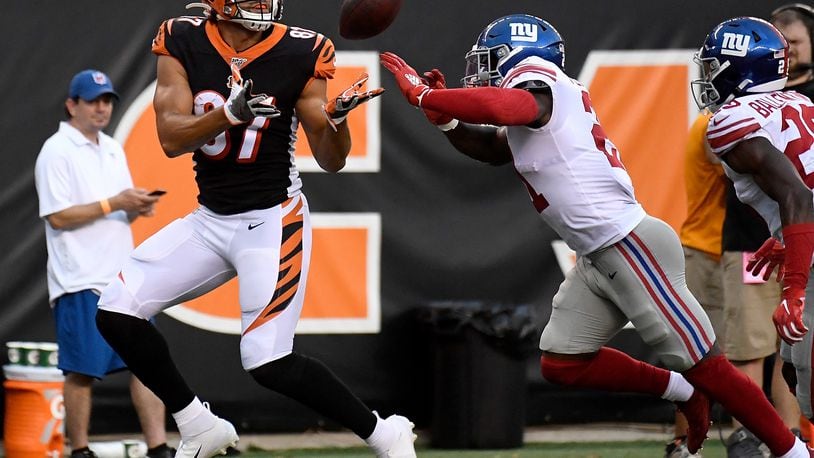 CINCINNATI, OH - AUGUST 22: C.J. Uzomah #87 of the Cincinnati Bengals catches a touchdown pass in the first quarter of the preseason game against the New York Giants at Paul Brown Stadium on August 22, 2019 in Cincinnati, Ohio. (Photo by Bobby Ellis/Getty Images)