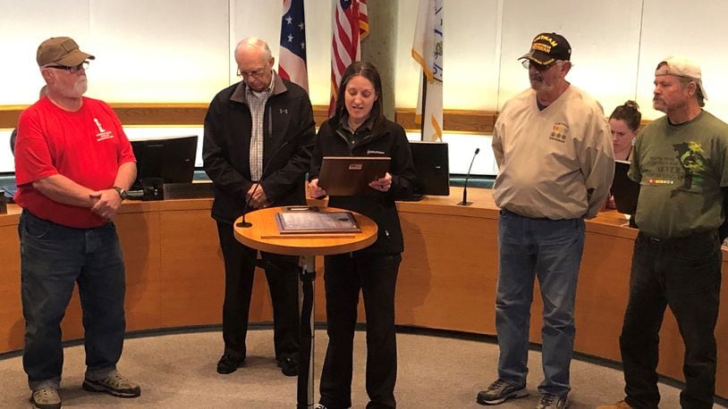 Middletown Mayor Nicole Condrey reads a proclamation during last week's City Council meeting declaring March Vietnam Veterans Day in the city. From left, Mike Gomia, Harvey Poff, Condrey, Paul Hannah and Randy Cornett. RICK McCRABB/STAFF