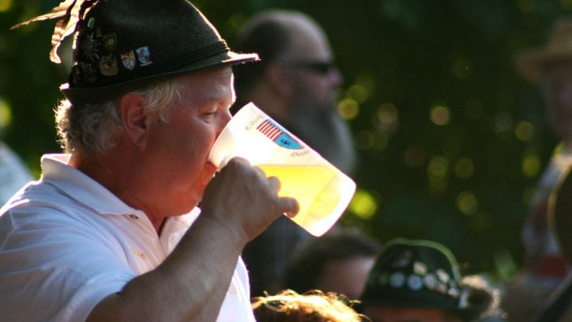 Walt Pegram, President of the Germania Society of Cincinnati, takes a drink of beer during the 2008 Oktoberfest held in Hamilton Saturday evening, August 30. The last day of the event is Sunday from 1pm-10pm. Photo by Jessica Uttinger, contributing photographer