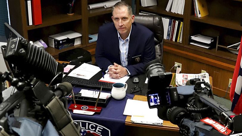 Fort Smith, Ark., Police Chief Danny Baker answers questions during a news conference. Authorities are investigating after a now-former 911 dispatcher scolded a frantic newspaper delivery woman for driving into floodwaters; the woman later drowned.