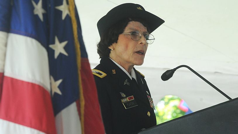 Kathy Platoni, Psy.D., retired U.S. army colonel, gives Memorial Day address at the Dayton National Cemetery Memorial Day ceremony, Monday, May 30, 2016.
