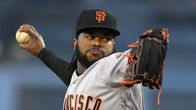San Francisco Giants starting pitcher Johnny Cueto throws to the plate during the first inning of a baseball game against the Los Angeles Dodgers, Monday, May 1, 2017, in Los Angeles. (AP Photo/Mark J. Terrill)