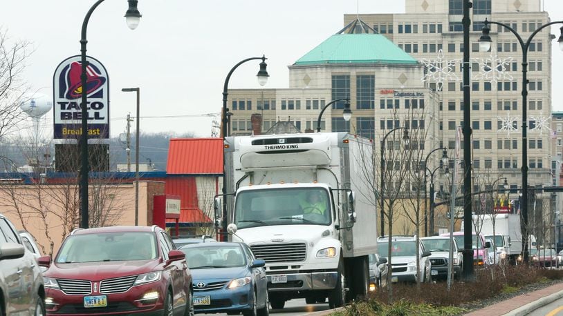 Hamilton City Manager Joshua Smith has had it up to here with how long it takes to drive along High Street in the city, and wants to tweak the traffic-signal timing in an effort to improve it. GREG LYNCH / STAFF