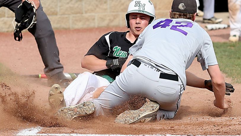New Miami’s Christian Acus slides under the tag of Miami Valley Christian Academy pitcher Nathaniel Arington during their Division IV sectional final Wednesday at Kings. CONTRIBUTED PHOTO BY E.L. HUBBARD