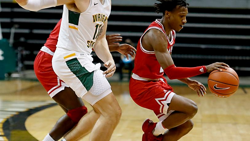 Miami guard Mekhi Lairy is covered by Wright State center Loudon Love during a mens basketball game at the Nutter Center in Fairborn Saturday, Dec. 5, 2020. E.L. Hubbard/CONTRIBUTED