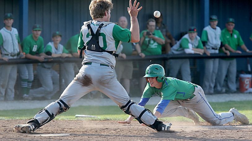 Badin catcher Zac Wilson takes the throw as Chaminade Julienne’s Cameron Benoit scores the winning run in the bottom of the seventh inning Thursday during a Division II sectional final at Miamisburg. CONTRIBUTED PHOTO BY E.L. HUBBARD
