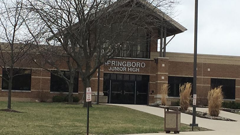 A 12-year-old Clearcreek Twp. boy accused of prompting a lockdown during a dance Friday night at Springboro Junior High School will remain in juvenile detention, pending a risk assessment.
