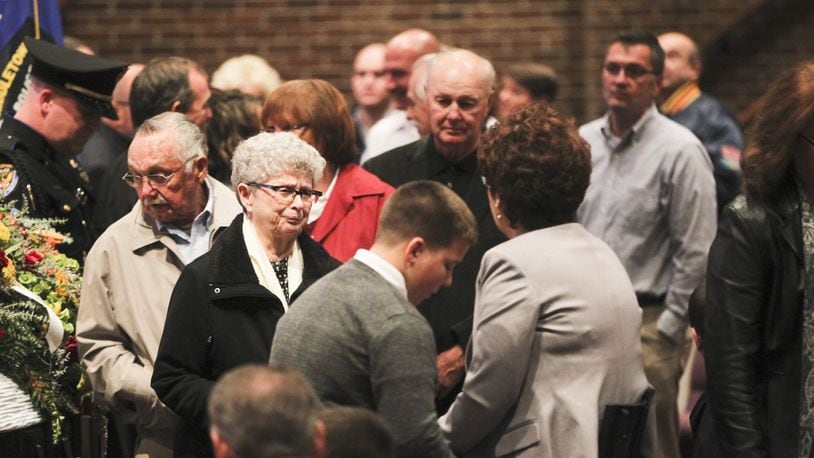 A crowd stands in line at Towne Boulevard First Church of God in Middletown on Friday, Nov. 15, for the visitation service of retired Officer Mike Davis, former director of the Middletown’s Safety Town program and a school resource officer for 26 of his 44-year career with the Middletown Division of Police. Davis died Wednesday at Atrium Medical Center. He was 65. GREG LYNCH / STAFF