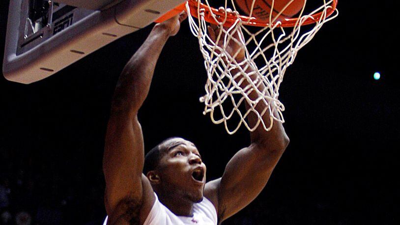 The University of Dayton’s Chris Wright slams one home against New Mexico at UD Arena on Jan. 1, 2011. Wright had 17 points and 14 rebounds in the game. Dayton Daily News file