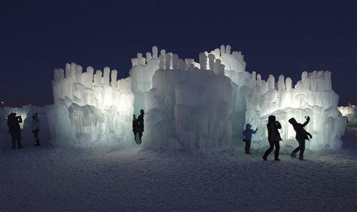 Visitors explore the 20-foot high Ice Castle at the Mall of America in Bloomington, Minn.