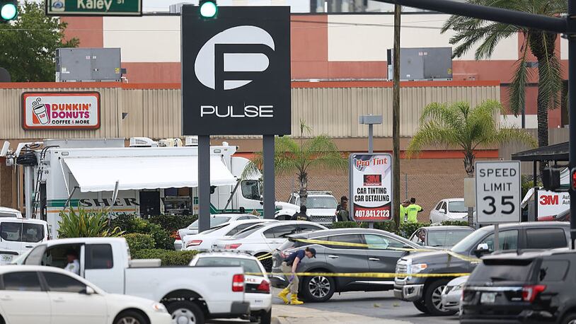 ORLANDO, FL - JUNE 12: Law enforcement officials investigate near the Pulse Nightclub where Omar Mateen allegedly killed at least 50 people on June 12, 2016 in Orlando, Florida. The mass shooting killed at least 50 people and injuring 53 others in what is the deadliest mass shooting in the country's history.  (Photo by Joe Raedle/Getty Images)