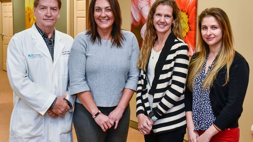 Phillip Carr (from left), Kelly Cole, Beverly Alten and Anna Parizh are physicians at Kettering Physician Network Women’s Health Hamilton across from Fort Hamilton Hospital in Hamilton. Alten and Parizh recently joined the practice to add resources to the Hamilton office.