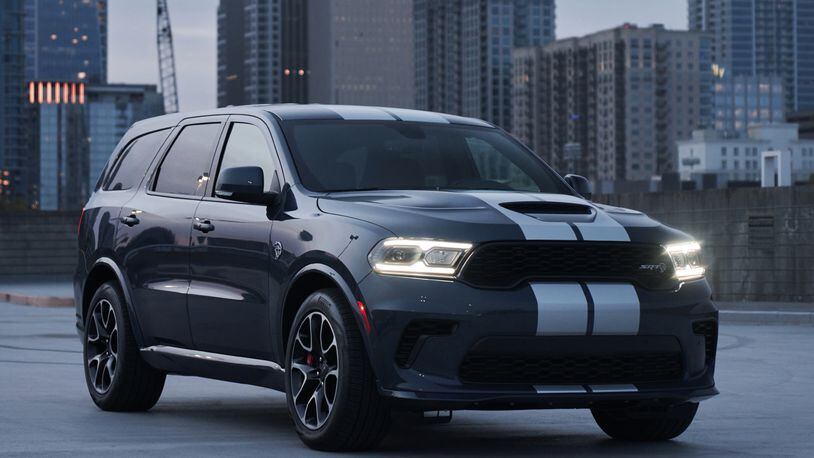 2021 Dodge Durango SRT Hellcat: The most powerful SUV ever features a new aggressive exterior, a new interior with a driver-centric cockpit and delivers 710 horsepower, shown here in Reactor Blue with Dual Silver stripes. Dodge photo