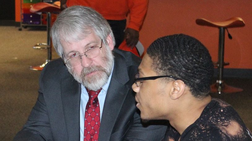State Superintendent of Public Instruction Paolo DeMaria (left) listens to Darius Watkins discuss the impact of Career ConnectED on his education. Ohio has had only an interim state superintendent since DeMaria resigned in September 2021.  JEFF GUERINI/STAFF