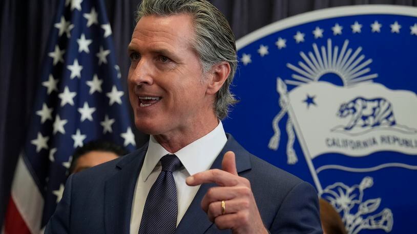 FILE - California Gov. Gavin Newsom during a news conference, March 21, 2024, in Los Angeles. California announced Thursday, May 9, 2024, it is partnering with five companies to develop generative AI tools to help deliver public services. (AP Photo/Damian Dovarganes, File)