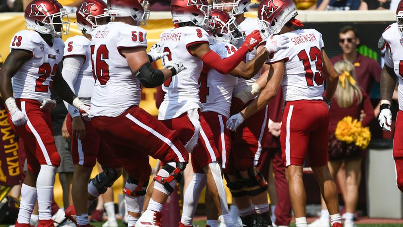 Miami-Ohio Wide Receiver Jack Sorenson (13) celebrates with his teammates after catching a 23-yard pass for a touchdown during the second half of an NCAA college football game against Minnesota, Saturday, Sept. 11, 2021, in Minneapolis. Minnesota won 31-26. (AP Photo/Craig Lassig)