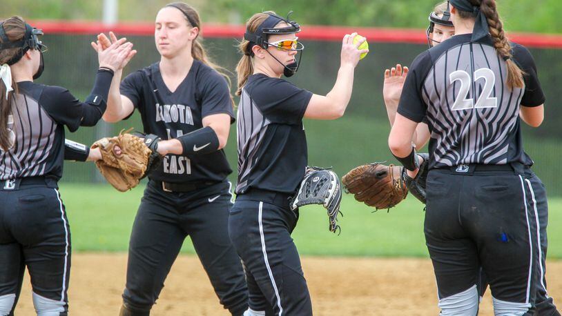 Lakota East pitcher Sydney Larson (with ball) celebrates with teammates during their game at Lakota West on Tuesday. GREG LYNCH/STAFF