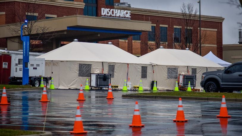 Special tents have been erected outside the emergency area of Atrium Medical Center in Middletown to deal with the coronavirus (COVID-19) outbreak. NICK GRAHAM / STAFF