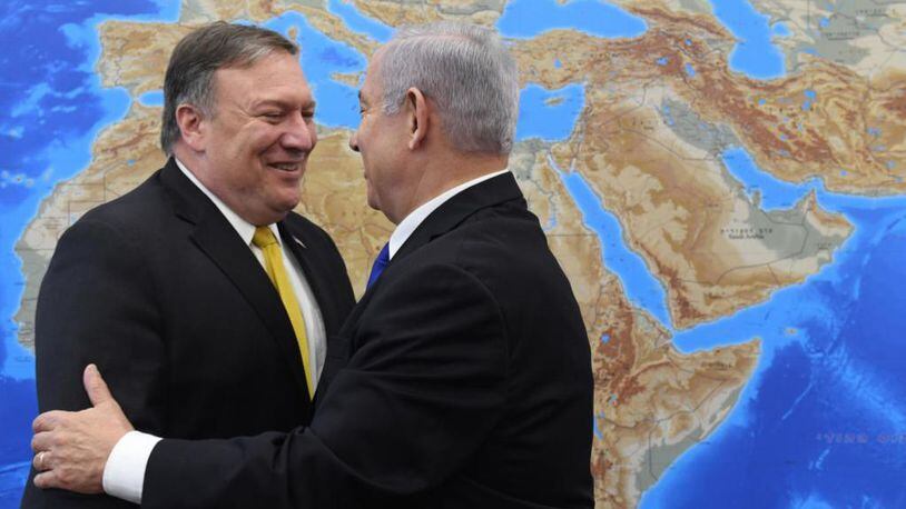 Secretary of State Mike Pompeo. left. embraces  Israel's Prime Minister, Benjamin Netanyahu, Sunday in Tel Aviv.
