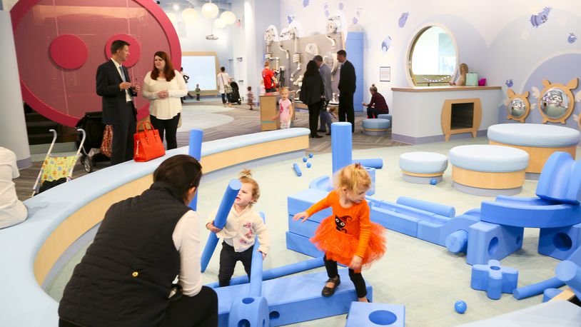 Shoppers visit the children’s area in the Foundry at Liberty Center. GREG LYNCH / STAFF