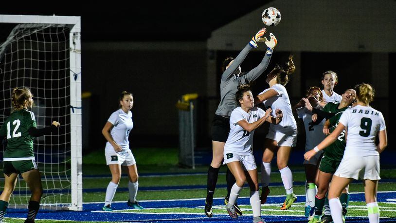 Badin goalkeeper Mackayla Kowalski jumps up to grab the ball during a 2017 Division II sectional final soccer game. NICK GRAHAM/STAFF