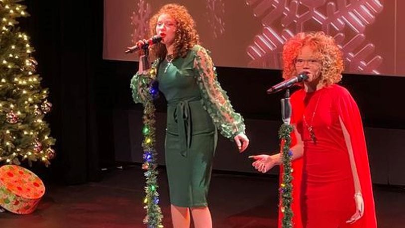 Macie Cunningham, left, and Marie Cunningham, right perform during "Christmas with The Cunninghams" at The Fitton Center in Hamilton on Dec. 19, 2021. The duo was on the latest season of NBC's "The Voice" on Team Kelly. FILE