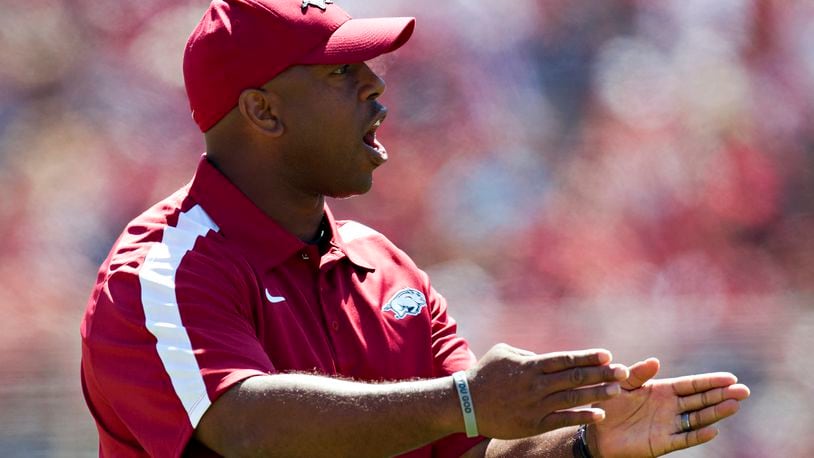 FAYETTEVILLE, AR - APRIL 21:   Interim Head Coach Taver Johnson of the Arkansas Razorbacks talks to his players on the field during the Spring Game at Donald W. Reynolds Stadium on April 21, 2012 in Fayetteville, Arkansas.  (Photo by Wesley Hitt/Getty Images)