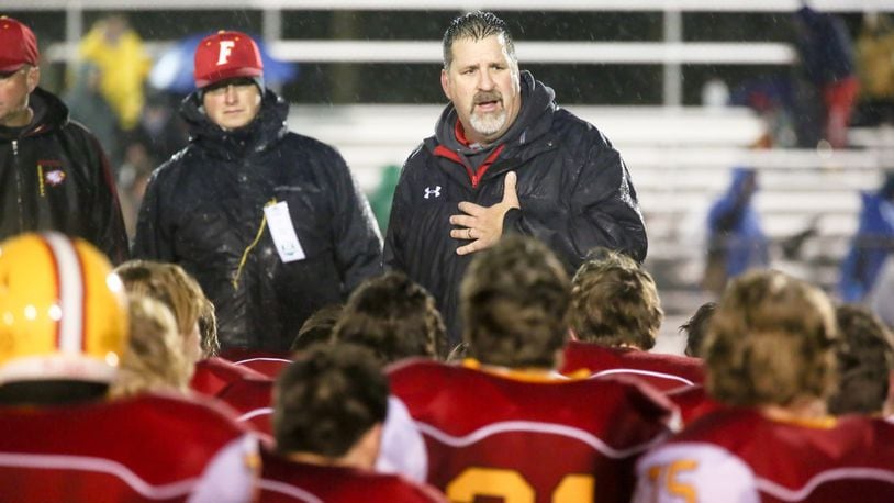 Fenwick coach Joe Snively talks to his team Nov. 28, 2015, after the Falcons lost to Columbus Hartley 26-14 in a Division IV state semifinal at Wilmington’s Alumni Field. GREG LYNCH/STAFF
