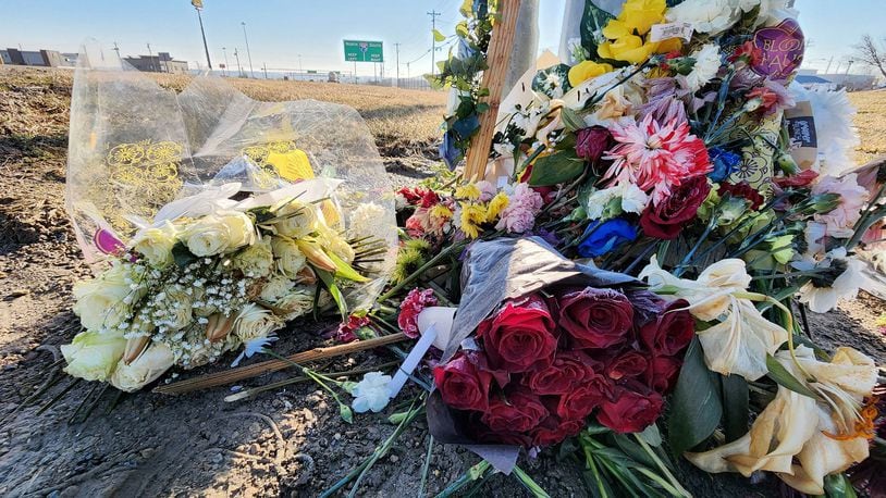 Flowers lay at the site where Dustin Booth died after he was shot during an incident with Monroe police, which took pace near Garver Road and Ohio 63. NICK GRAHAM / STAFF