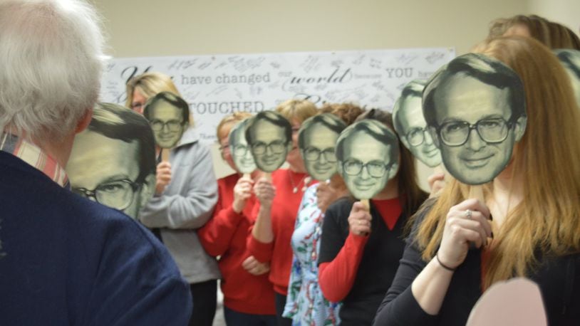 Dr. Terry Hunt was greeted with a roomful of well-wishers holding cutouts of his face as he entered during his retirement tour of McCullough-Hyde Memorial Hospital March 16, a day proclaimed Dr. Terry Hunt Day in Oxford by Mayor Kate Rousmaniere. CONTRIBUTED/BOB RATTERMAN