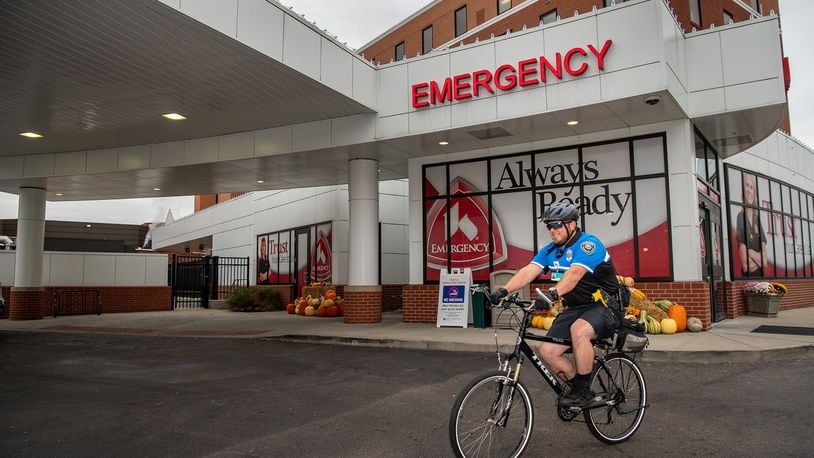 Officer Jordan Schenck, of Kettering Health Network Police at Fort Hamilton Hospital, patrols the area around the hospital Tuesday, Oct. 29, 2019. The health network last month added a bike patrol to the police force it installed at the facility earlier this year. CONTRIBUTED