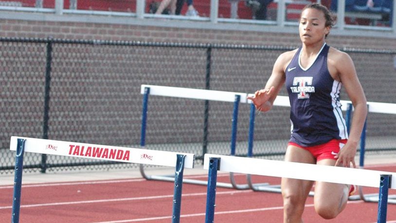 Talawanda’s Kyra Koontz, shown winning the 100-meter hurdles April 16 in the Dale Plank Invitational in Oxford, has qualified for the Division I state track & field tournament in that event. RICK CASSANO/STAFF