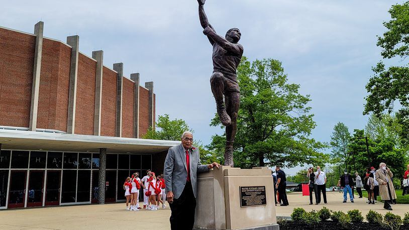 Wayne Embry stands during statue is unveiled in his honor Tuesday, May 18, 2021 at Miami University in Oxford. Wayne Embry and his late wife Theresa Embry, both Miami alumni, were awarded the Freedom of Summer of '64 Award for their life's work as civil right champions and mentors. A statue of Wayne Embry in a basketball pose, created by sculptor Tom Tsuchiya, was unveiled in front of Millett Hall and a scholarship in his name was announced to support Miami varsity men's basketball student athletes. NICK GRAHAM / STAFF
