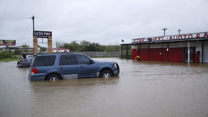 There is significant flooding along Texas 71 at Dry Creek at the Bastrop-Travis county line. (Photo by Jay Janner/American-Statesman)