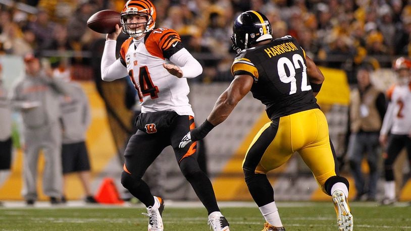 PITTSBURGH, PA - DECEMBER 28:  Andy Dalton #14 of the Cincinnati Bengals throws a pass in front of James Harrison #92 of the Pittsburgh Steelers during the first quarter at Heinz Field on December 28, 2014 in Pittsburgh, Pennsylvania.  (Photo by Justin K. Aller/Getty Images)