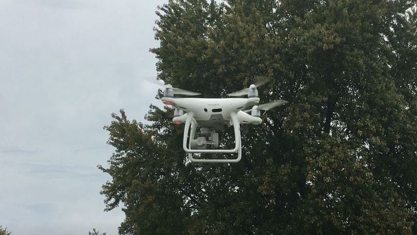 Hamilton’s drone, purchased a few years ago, takes off at Joyce Park. The machine make it much faster for electric crews to search for wires that are down after storms, and has other benefits. MIKE RUTLEDGE/STAFF