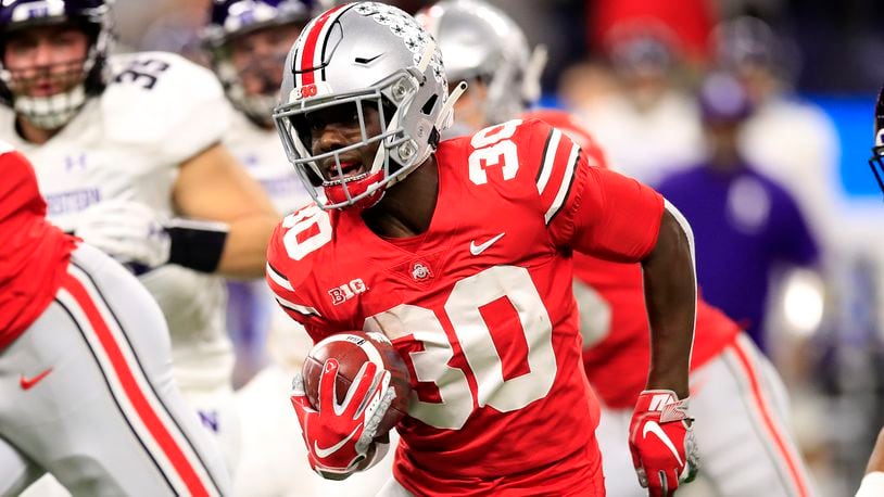 INDIANAPOLIS, INDIANA - DECEMBER 01: Demario McCall #30 of the Ohio State Buckeyes runs the ball against the Northwestern Wildcats in the first quarter at Lucas Oil Stadium on December 01, 2018 in Indianapolis, Indiana. (Photo by Andy Lyons/Getty Images)