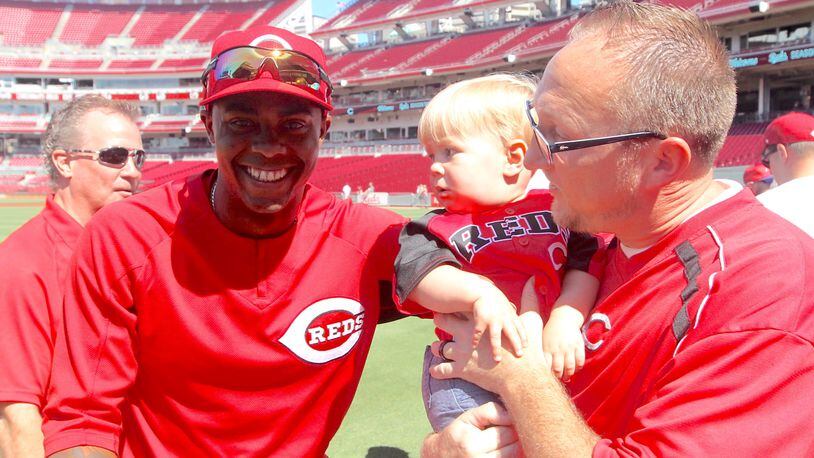 Reds closer Raisel Iglesias poses for a photo with fans before a game against the Cubs on Sunday, July 2, 2017, at Great American Ball Park in Cincinnati.