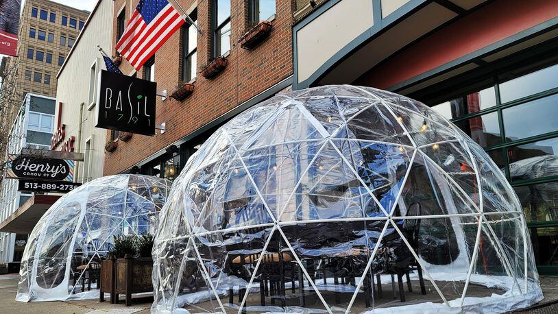 Basil 1791 on High Street in Hamilton has installed igloos for outdoor dining on the sidewalk in front of the restaurant. NICK GRAHAM / STAFF