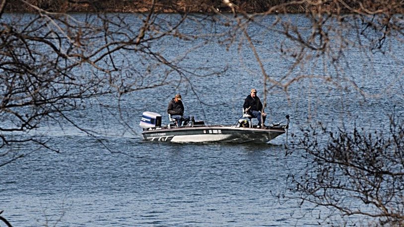 Fisherman take advantage of sunny skies and warm weather on Eastwood Lake in February. MARSHALL GORBY / STAFF