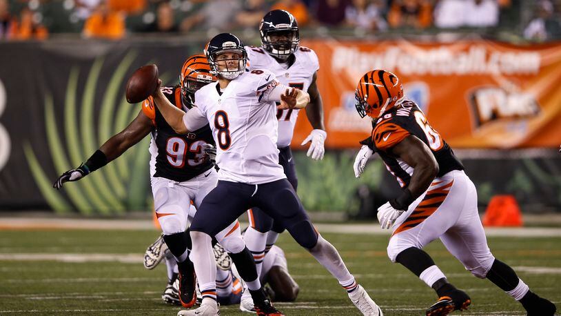 Jimmy Clausen #8 of the Chicago Bears looks to pass while under pressure from DeShawn Williams #69 of the Cincinnati Bengals in the third quarter of a preseason game at Paul Brown Stadium on August 29, 2015 in Cincinnati, Ohio. (Photo by Joe Robbins/Getty Images)