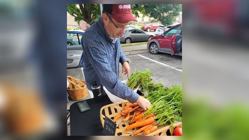 Greg Hamm has larger carrots for sale at the 2023 Oxford Farmers Market. CONTRIBUTED