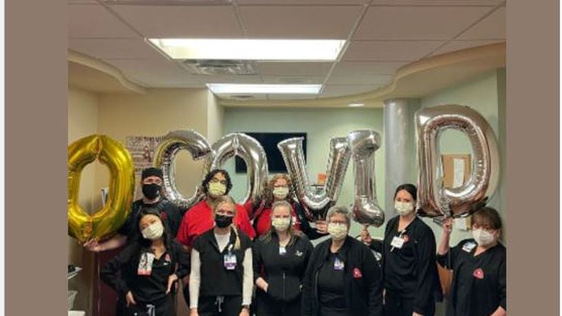 A team of nurses at Kettering Health Main Campus celebrates zero COVID-19 patients in their hospital. CONTRIBUTED/KETTERING HEALTH